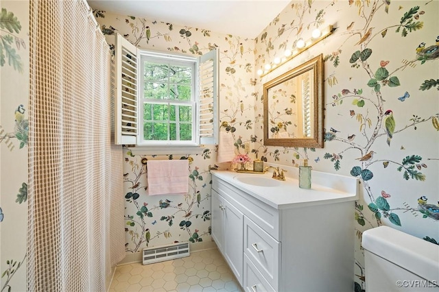 full bath featuring wallpapered walls, vanity, tile patterned floors, and toilet