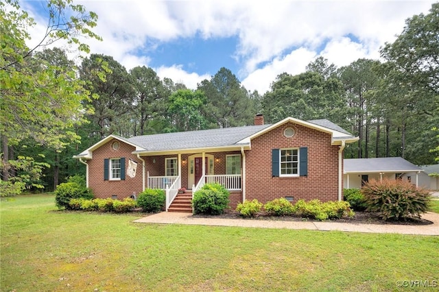 ranch-style house with covered porch, brick siding, a front yard, crawl space, and a chimney