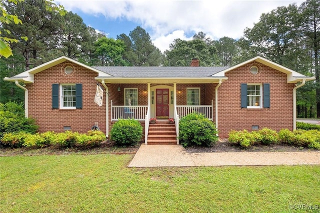 view of front of house with crawl space, brick siding, a front yard, and covered porch