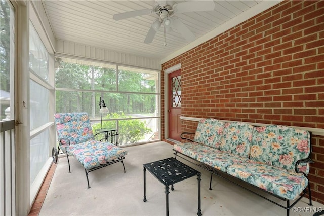 sunroom featuring ceiling fan