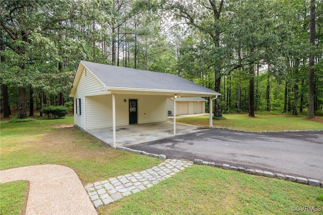 view of car parking featuring asphalt driveway
