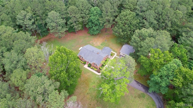 aerial view of property's location with a forest
