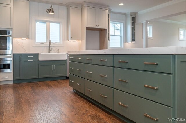 12543 N Readers Ln, Manakin Sabot, VA 23103 - kitchen featuring a sink, ornamental molding, green cabinets, dark wood finished floors, and light stone countertops