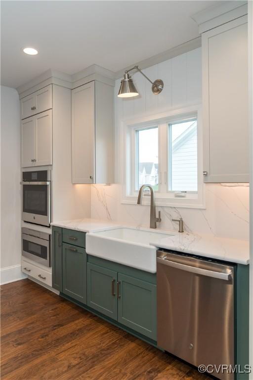 12543 N Readers Ln, Manakin Sabot, VA 23103 - kitchen with stainless steel dishwasher, green cabinetry, a sink, tasteful backsplash, and recessed lighting