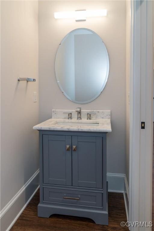 12543 N Readers Ln, Manakin Sabot, VA 23103 - bathroom featuring baseboards, vanity, and wood finished floors