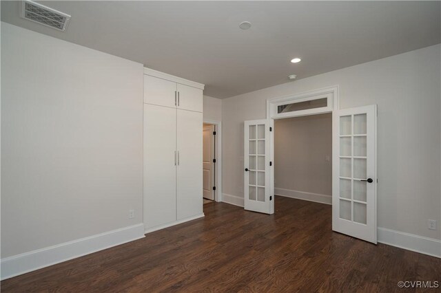 12543 N Readers Ln, Manakin Sabot, VA 23103 - unfurnished bedroom featuring french doors, dark wood-style flooring, baseboards, and recessed lighting