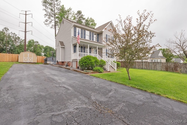 7418 Whirlaway Dr, Midlothian, VA 23112 - colonial house featuring covered porch, driveway, and stairway
