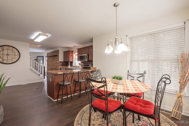 7418 Whirlaway Dr, Midlothian, VA 23112 - dining space with baseboards, dark wood-style flooring, a chandelier, stairway, and healthy amount of natural light