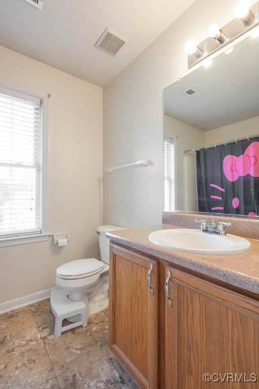 7418 Whirlaway Dr, Midlothian, VA 23112 - full bath featuring vanity, toilet, healthy amount of natural light, and baseboards