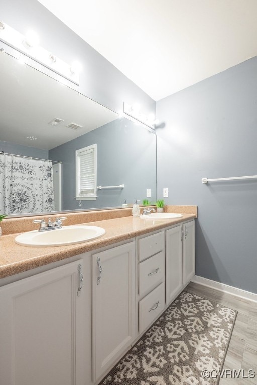 7418 Whirlaway Dr, Midlothian, VA 23112 - full bath with double vanity and baseboards
