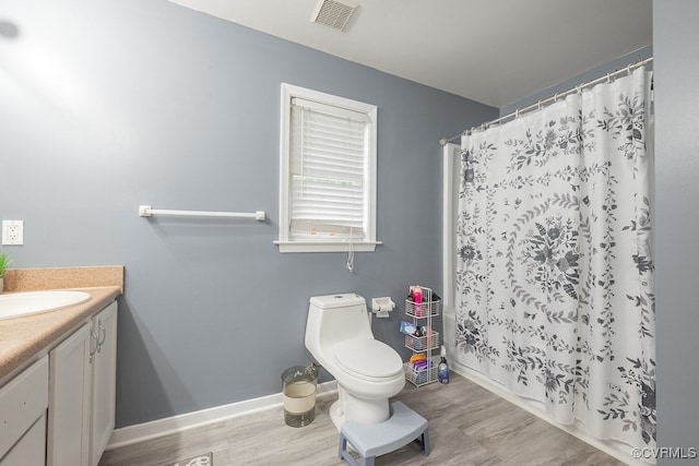 7418 Whirlaway Dr, Midlothian, VA 23112 - full bath with vanity, toilet, baseboards, a shower with curtain, and wood finished floors
