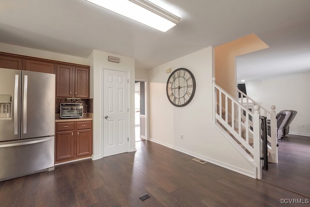 7418 Whirlaway Dr, Midlothian, VA 23112 - kitchen with stainless steel fridge with ice dispenser, dark wood-type flooring, tasteful backsplash, baseboards, and brown cabinets