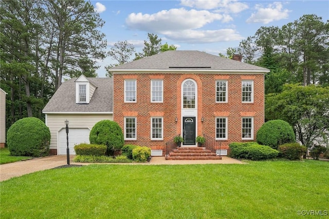 2545 Retrievers Ridge Rd, Henrico, VA 23233 - view of front of house with a front lawn, concrete driveway, an attached garage, and a chimney