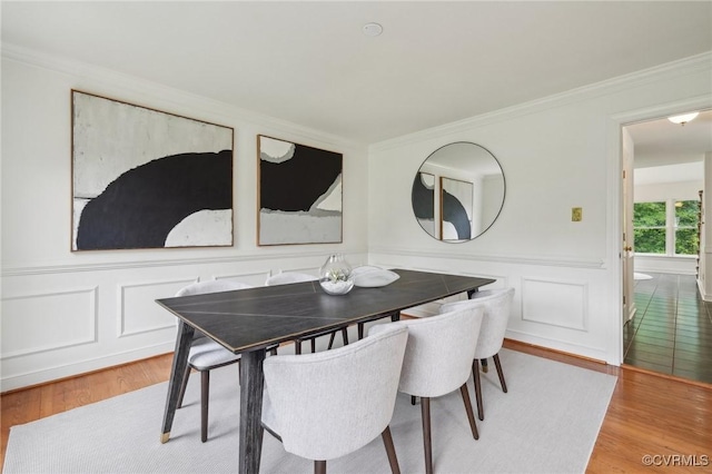 2545 Retrievers Ridge Rd, Henrico, VA 23233 - dining area with wood finished floors, crown molding, wainscoting, and a decorative wall