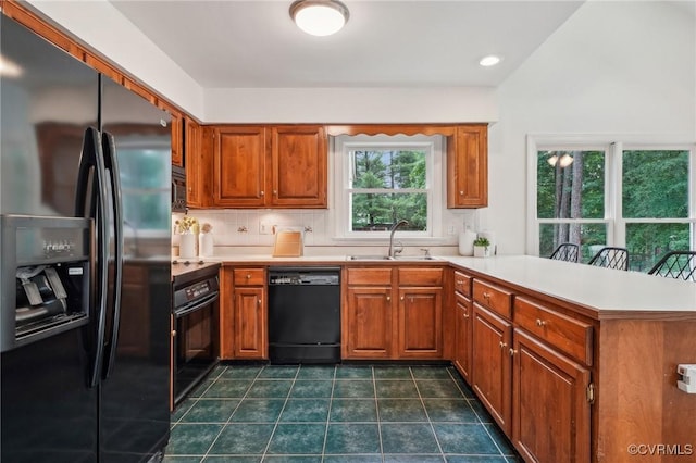 2545 Retrievers Ridge Rd, Henrico, VA 23233 - kitchen with black appliances, a sink, a peninsula, and brown cabinetry
