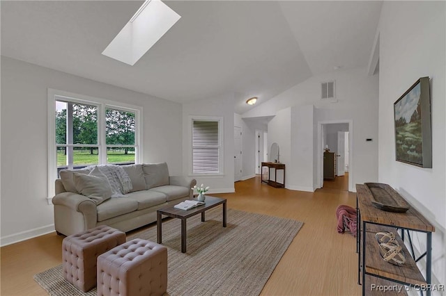 2480 Lees Neck Farm Rd, Saluda, VA 23149 - living area with vaulted ceiling, wood finished floors, baseboards, and a skylight
