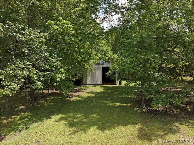 2480 Lees Neck Farm Rd, Saluda, VA 23149 - view of green lawn featuring an outdoor structure and a detached garage