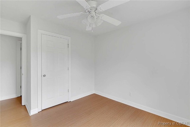 2480 Lees Neck Farm Rd, Saluda, VA 23149 - unfurnished room with baseboards, wood finished floors, and a ceiling fan