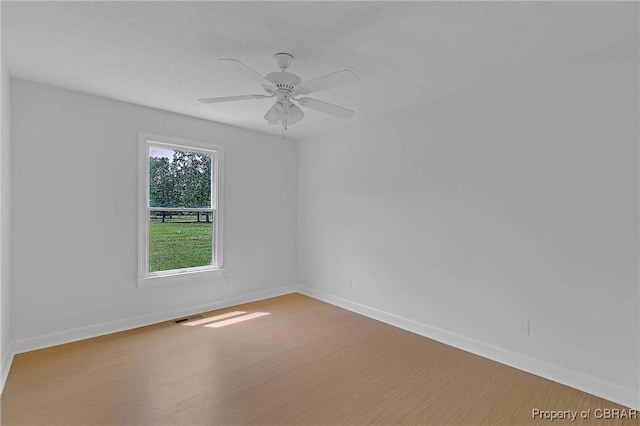 2480 Lees Neck Farm Rd, Saluda, VA 23149 - unfurnished room featuring baseboards, wood finished floors, and ceiling fan