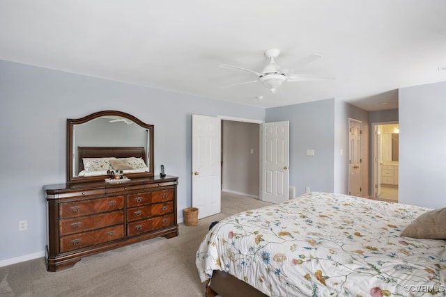 bedroom featuring carpet, baseboards, ceiling fan, and connected bathroom