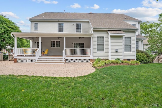 back of property featuring a patio area, a yard, crawl space, a shingled roof, and a ceiling fan