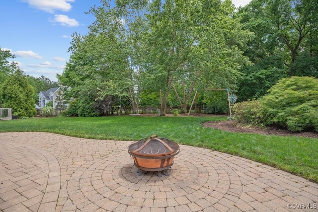 view of patio / terrace featuring an outdoor fire pit