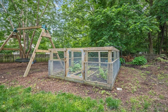 view of poultry coop featuring fence