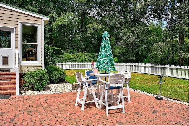 29507 Monroe Rd Unit 1, Franklin, VA 23851 - view of patio with outdoor dining space and view of wooded area