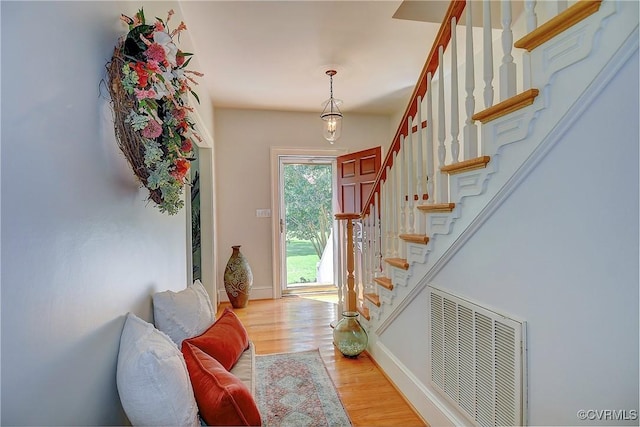 29507 Monroe Rd Unit 1, Franklin, VA 23851 - entrance foyer with light wood-style flooring, stairway, and baseboards