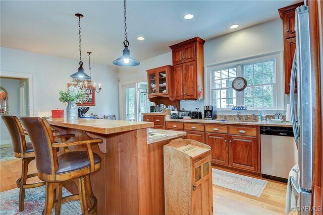 29507 Monroe Rd Unit 1, Franklin, VA 23851 - kitchen featuring stainless steel appliances, a breakfast bar, light countertops, plenty of natural light, and recessed lighting