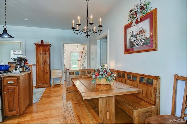 29507 Monroe Rd, Franklin, VA 23851 - dining space featuring light wood-style flooring, a chandelier, and healthy amount of natural light