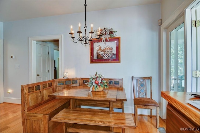 29507 Monroe Rd Unit 1, Franklin, VA 23851 - dining room with light wood-style flooring, a chandelier, and baseboards