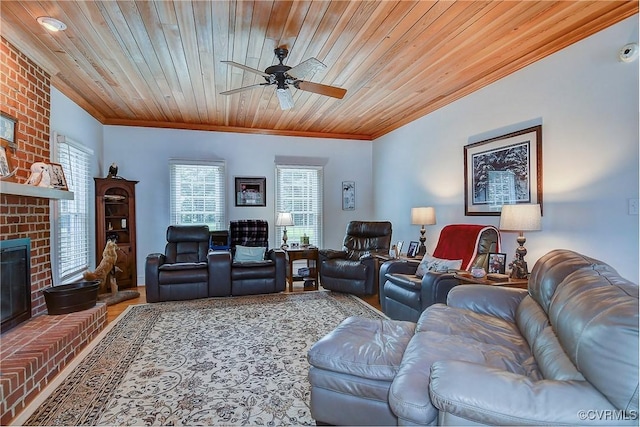 29507 Monroe Rd Unit 1, Franklin, VA 23851 - living area featuring ornamental molding, a ceiling fan, wooden ceiling, a brick fireplace, and wood finished floors