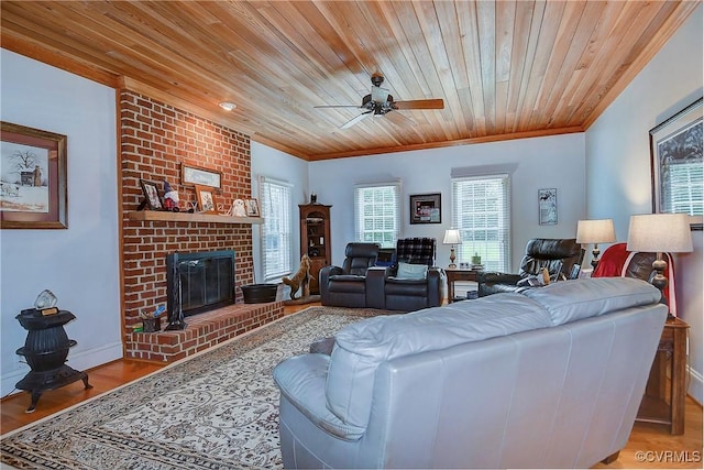 29507 Monroe Rd Unit 1, Franklin, VA 23851 - living area featuring ceiling fan, wood ceiling, light wood-style flooring, ornamental molding, and a brick fireplace