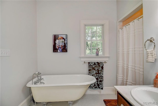 29507 Monroe Rd Unit 1, Franklin, VA 23851 - full bathroom featuring a soaking tub, baseboards, vanity, and tile patterned flooring