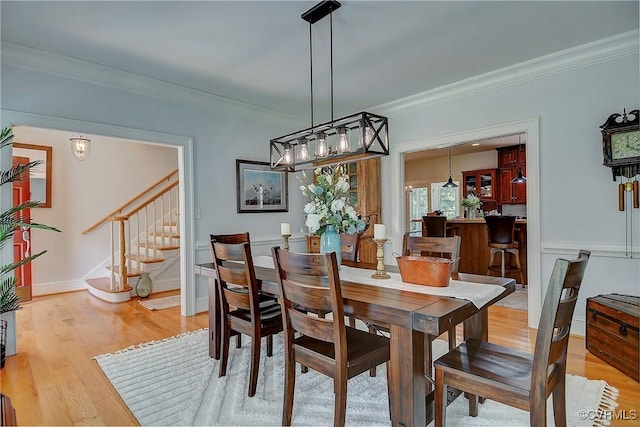 29507 Monroe Rd, Franklin, VA 23851 - dining area featuring stairway, ornamental molding, and light wood-style flooring