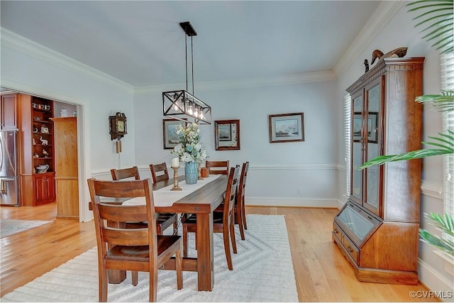 29507 Monroe Rd Unit 1, Franklin, VA 23851 - dining room featuring light wood-style floors, crown molding, and a chandelier