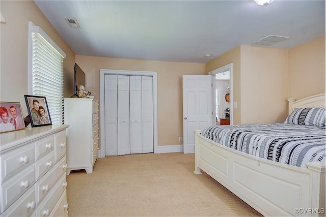 29507 Monroe Rd Unit 1, Franklin, VA 23851 - bedroom with light colored carpet, baseboards, and a closet