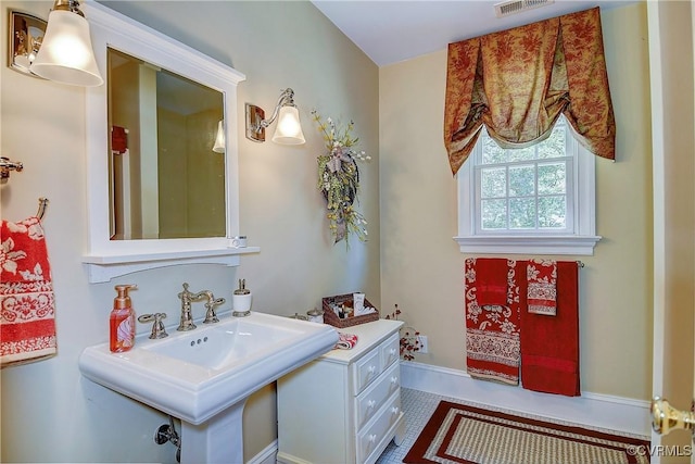 29507 Monroe Rd Unit 1, Franklin, VA 23851 - bathroom with a sink and tile patterned flooring