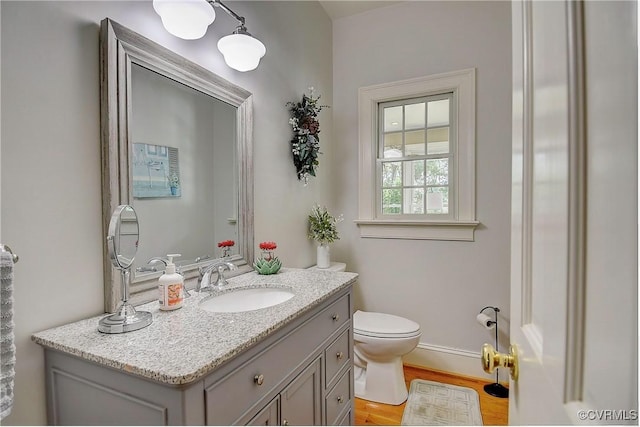 29507 Monroe Rd Unit 1, Franklin, VA 23851 - half bath featuring toilet, vanity, and wood finished floors