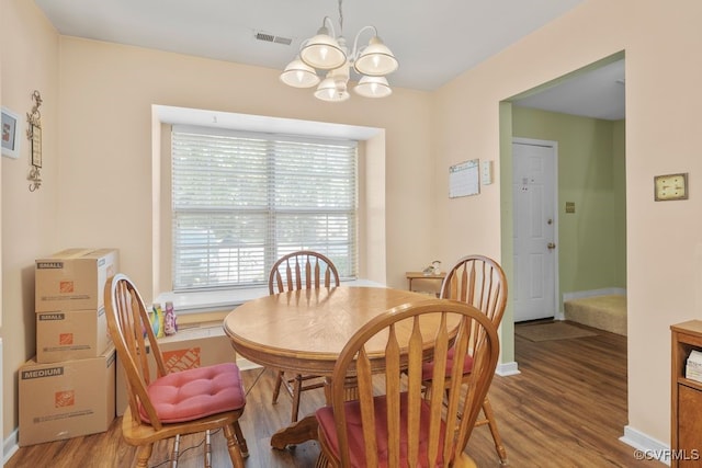 11693 Timberly Waye, Richmond, VA 23238 - dining space with a chandelier, light wood-type flooring, and baseboards