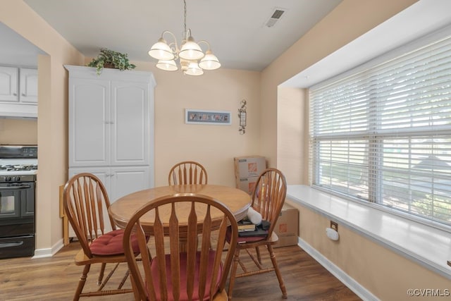 11693 Timberly Waye, Richmond, VA 23238 - dining room with a chandelier, light wood-type flooring, and baseboards