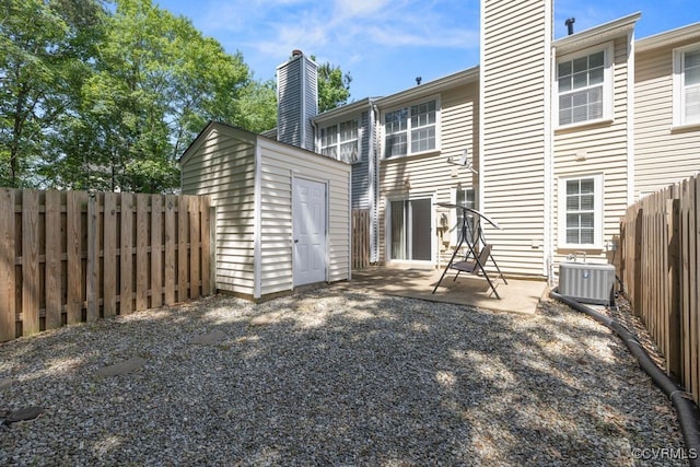 11693 Timberly Waye, Richmond, VA 23238 - rear view of house featuring a chimney, cooling unit, a fenced backyard, and a patio