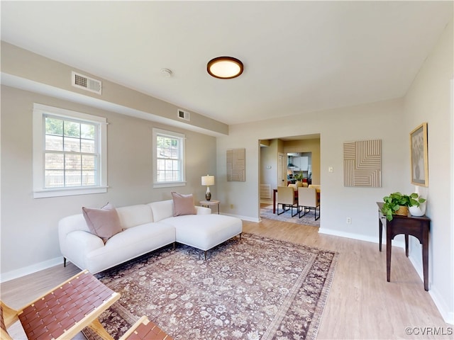 56 Mancha Ave, Claremont, VA 23899 - living area featuring light wood-type flooring and baseboards