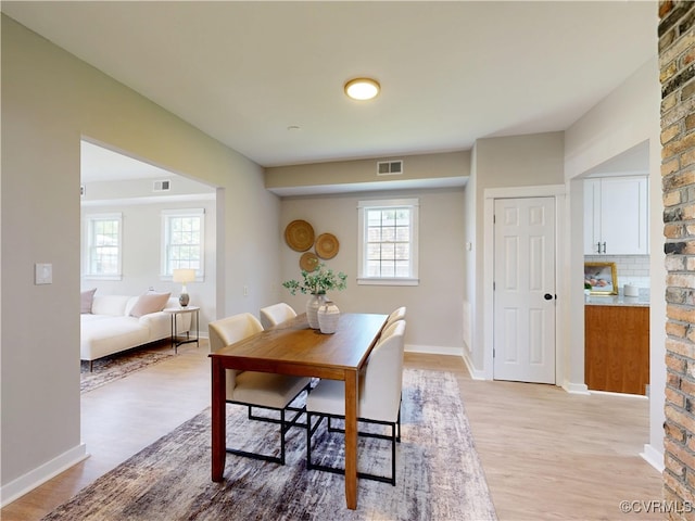 56 Mancha Ave, Claremont, VA 23899 - dining room with light wood-type flooring, healthy amount of natural light, and baseboards
