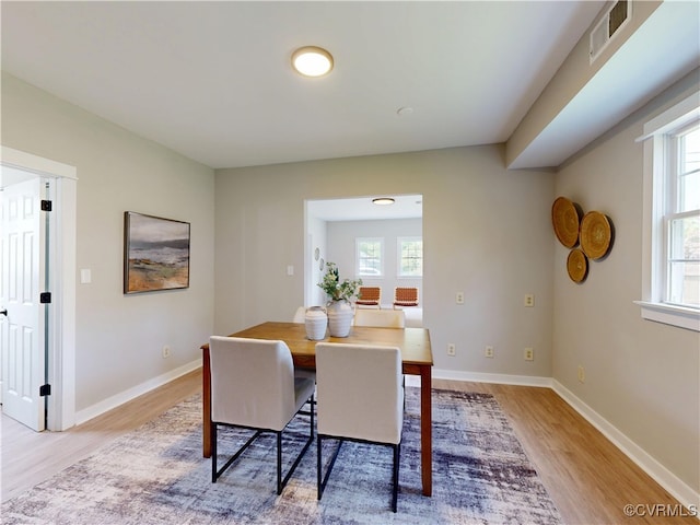 56 Mancha Ave, Claremont, VA 23899 - dining space with light wood-type flooring, healthy amount of natural light, and baseboards