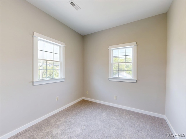 56 Mancha Ave, Claremont, VA 23899 - spare room featuring plenty of natural light, carpet, and baseboards