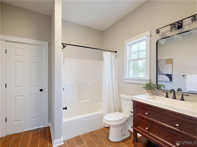 56 Mancha Ave, Claremont, VA 23899 - bathroom featuring wood finish floors, toilet, vanity, and shower / bath combo