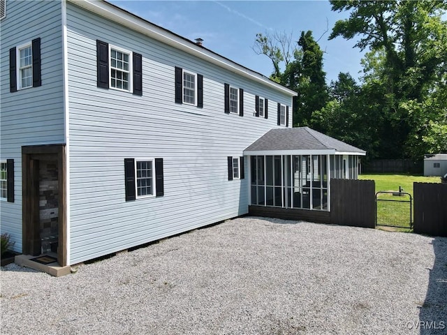 56 Mancha Ave, Claremont, VA 23899 - rear view of house with a sunroom
