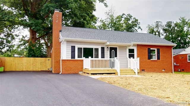 8803 Dena Dr, Henrico, VA 23229 - ranch-style house with a chimney, crawl space, brick siding, a shingled roof, and fence